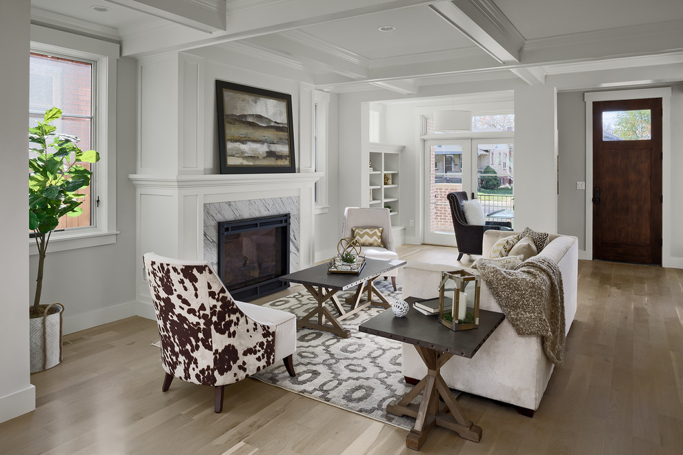 Inspiration for a medium sized contemporary open plan living room in Denver with a reading nook, white walls, a standard fireplace, a stone fireplace surround, no tv and beige floors.