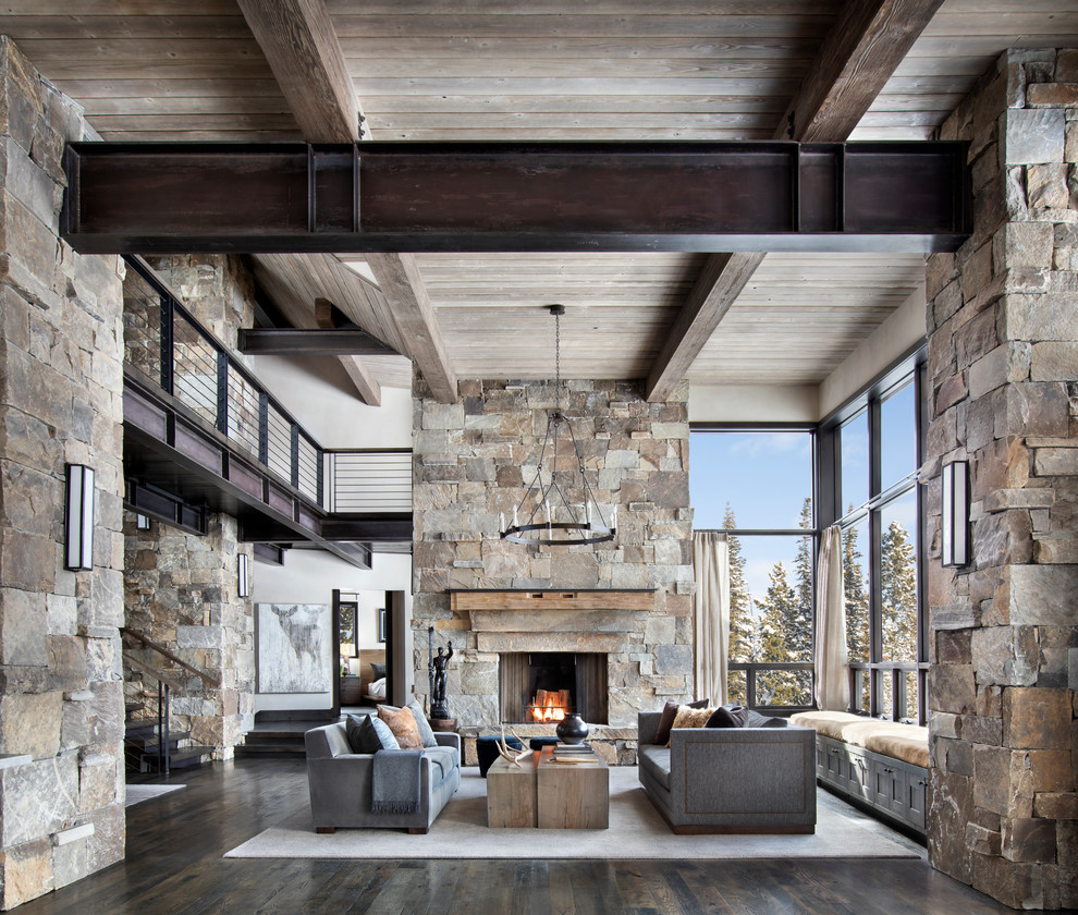 Inspiration for a large modern open concept and formal dark wood floor and brown floor living room remodel in Other with beige walls, a standard fireplace, a stone fireplace and no tv