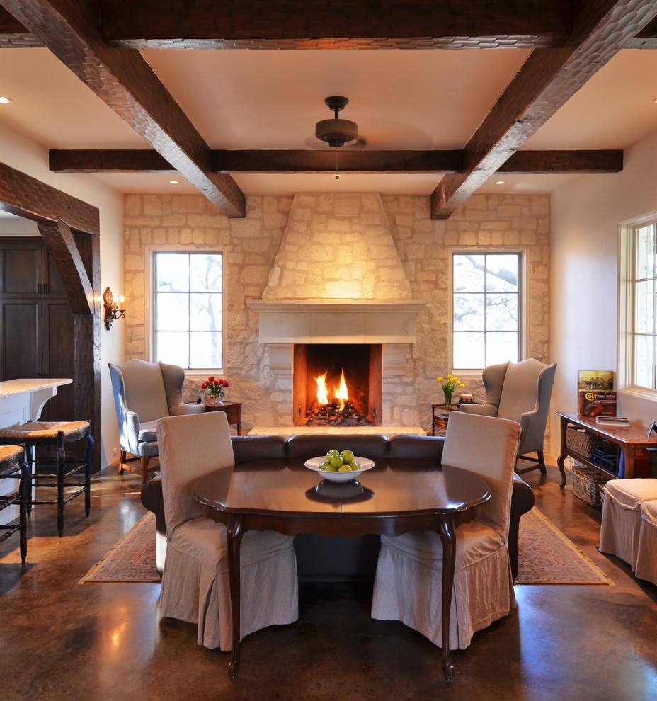 Farmhouse open concept concrete floor living room photo in Austin with a stone fireplace