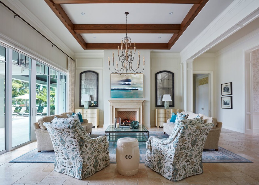 This is an example of a formal living room in Miami with white walls, a standard fireplace, no tv and beige floors.