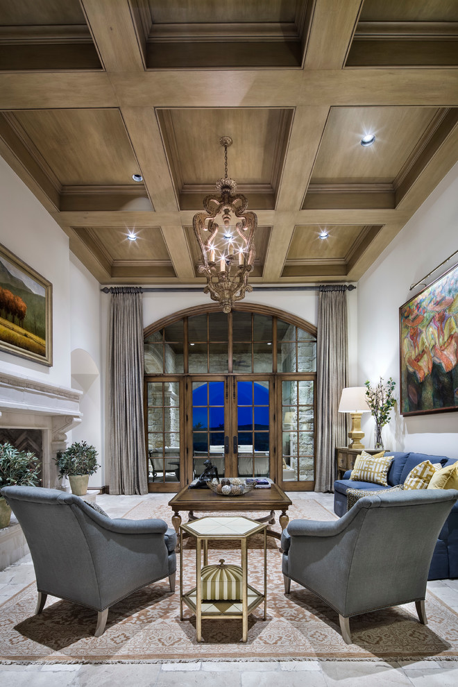 Large formal open plan living room in Austin with a two-sided fireplace and no tv.