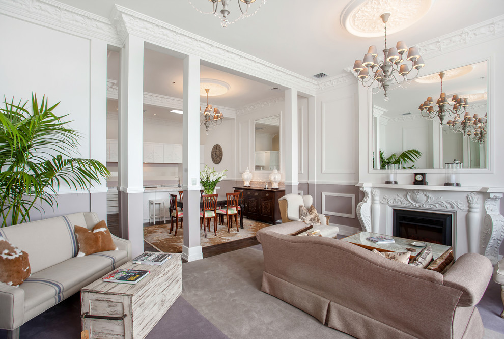 Aménagement d'un salon classique ouvert avec une salle de réception, un mur blanc, moquette, une cheminée standard et un manteau de cheminée en plâtre.