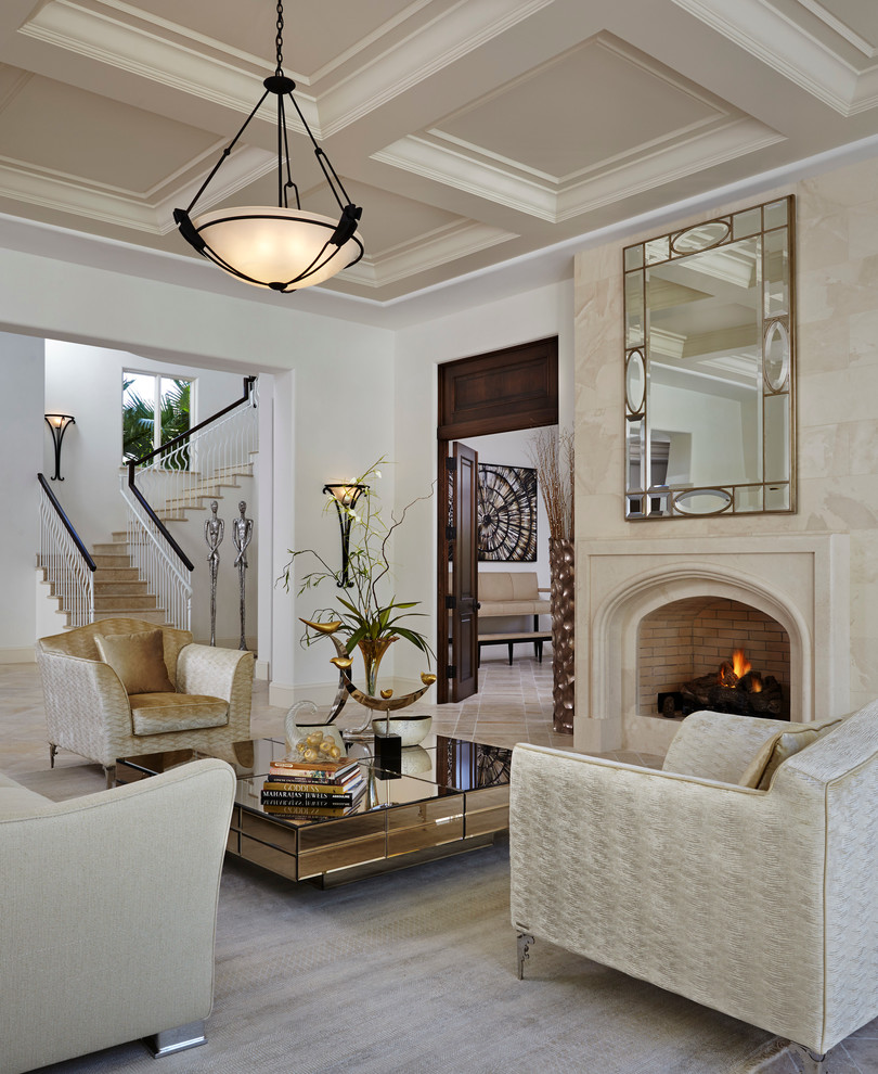 Design ideas for a large traditional formal living room in Miami with white walls, a standard fireplace and no tv.
