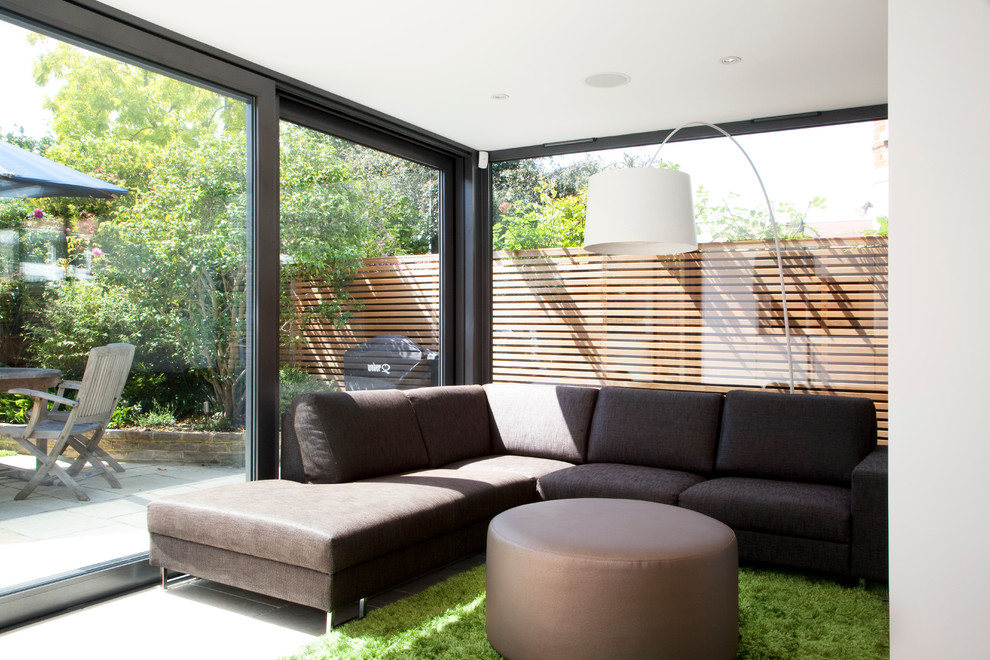 Design ideas for a modern open plan living room in London.