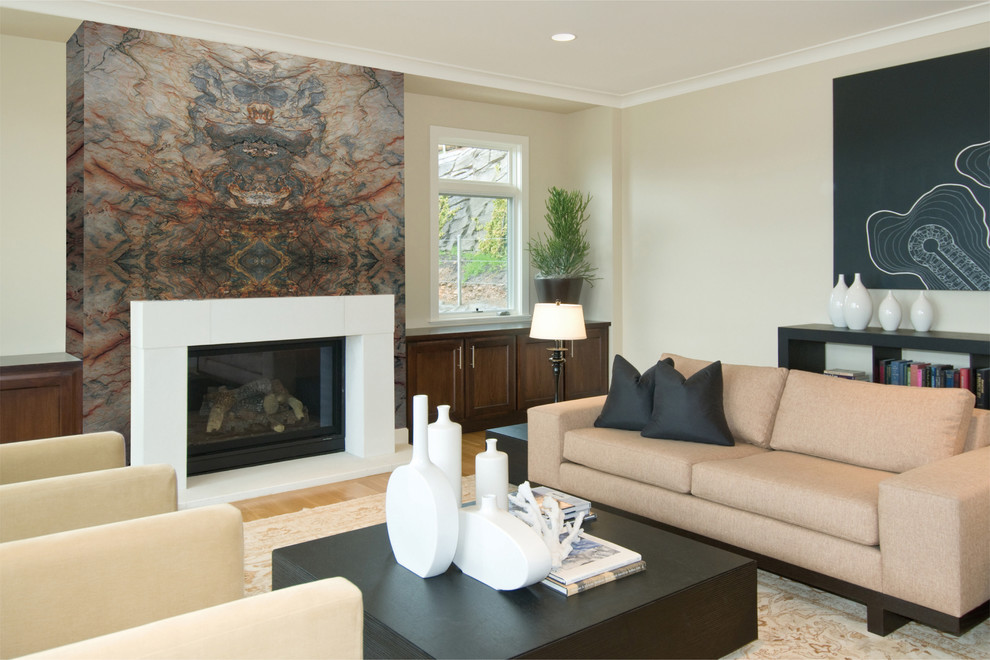 This is an example of a medium sized contemporary open plan living room in Miami with beige walls, light hardwood flooring, a standard fireplace and a plastered fireplace surround.
