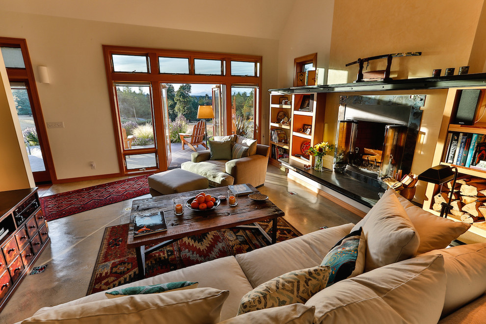 Living room - mid-sized country formal and enclosed concrete floor and gray floor living room idea in Seattle with white walls, a standard fireplace, a tile fireplace and no tv