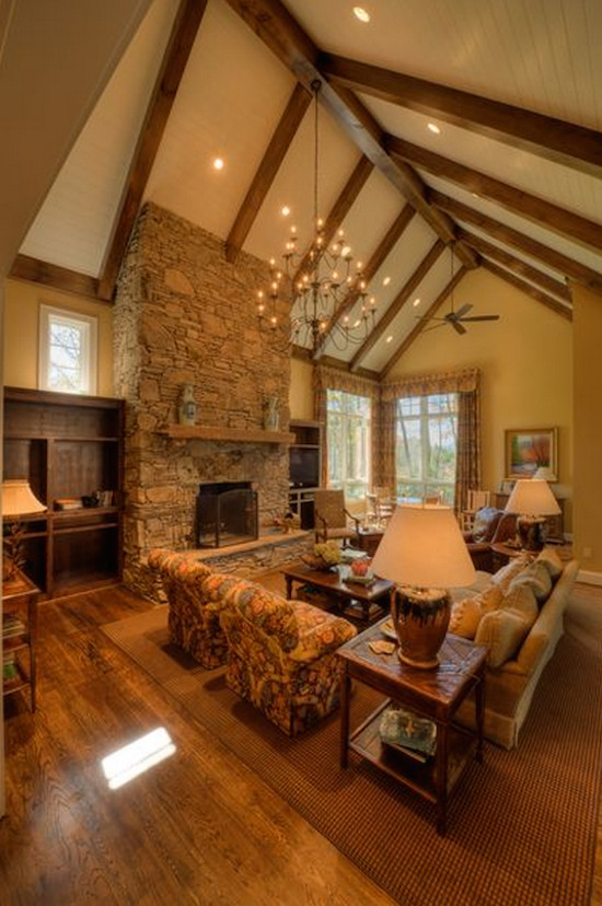 Large arts and crafts dark wood floor living room photo in Charlotte with yellow walls, a standard fireplace and a stone fireplace