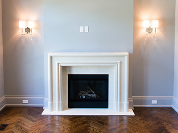 Inspiration for a living room in Toronto with medium hardwood flooring and a standard fireplace.