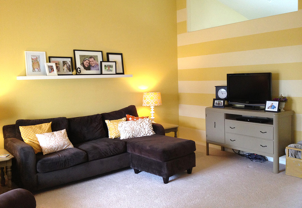 Mid-sized eclectic open concept carpeted living room photo in Portland with yellow walls, no fireplace and a tv stand