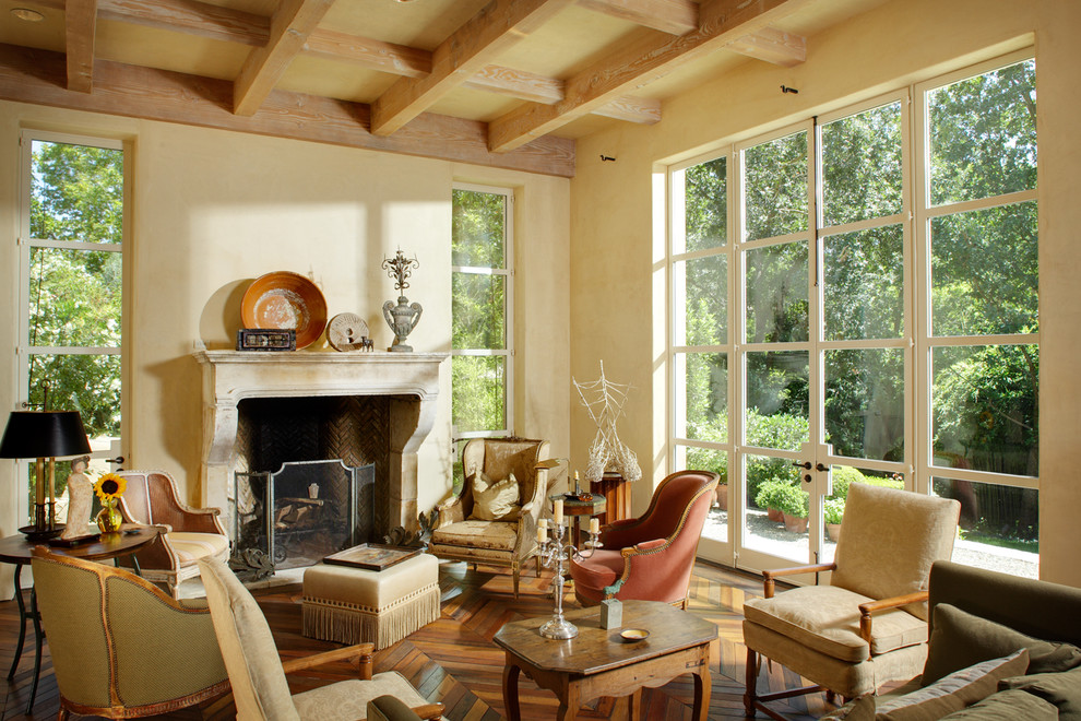Inspiration for a french country living room remodel in Sacramento with beige walls, a standard fireplace and no tv