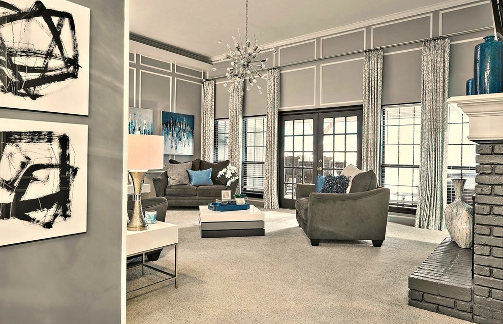 Идея дизайна: гостиная комната в современном стиле с серыми стенами, двусторонним камином, фасадом камина из кирпича, телевизором на стене и серым полом