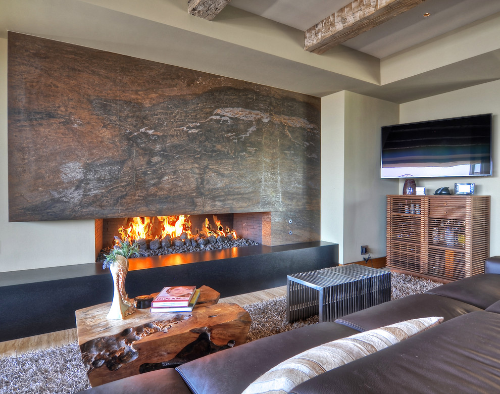 Photo of a contemporary living room in Orange County with a ribbon fireplace and a wall mounted tv.