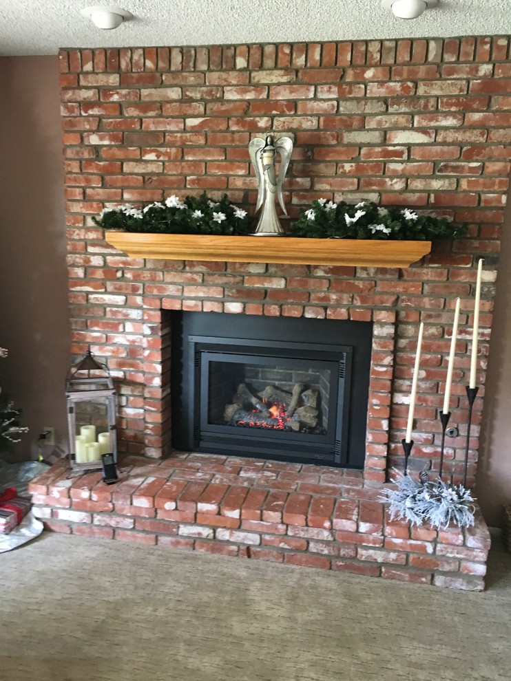 Design ideas for a medium sized classic enclosed living room in Santa Barbara with brown walls, a standard fireplace, a brick fireplace surround and no tv.