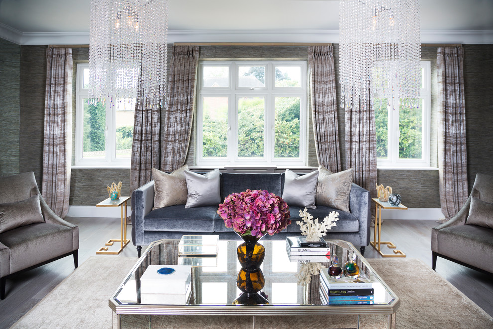 This is an example of a classic living room in London with grey walls and dark hardwood flooring.