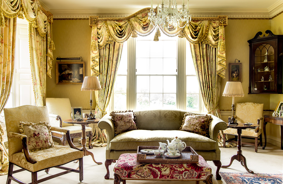 Inspiration for a medium sized classic enclosed living room in London with yellow walls, carpet and beige floors.