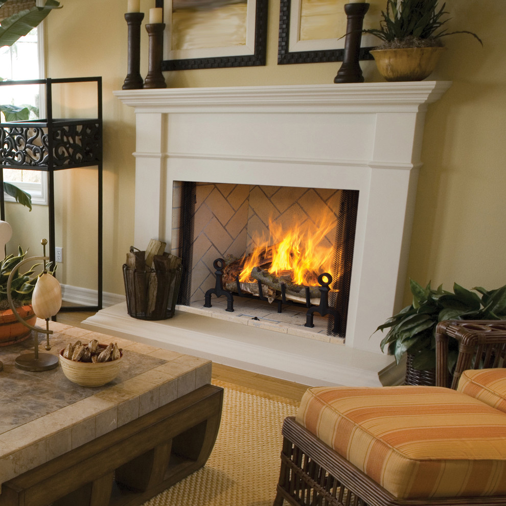 Living room - traditional living room idea in Orange County with a standard fireplace and a wood fireplace surround