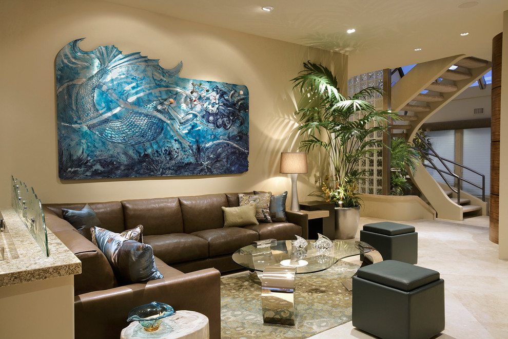 Inspiration for a large tropical open concept ceramic tile living room remodel in Orange County with beige walls