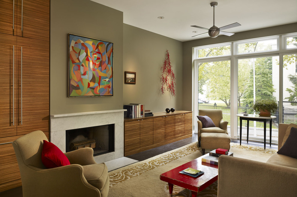 Inspiration for a modern living room remodel in Philadelphia with green walls and a standard fireplace
