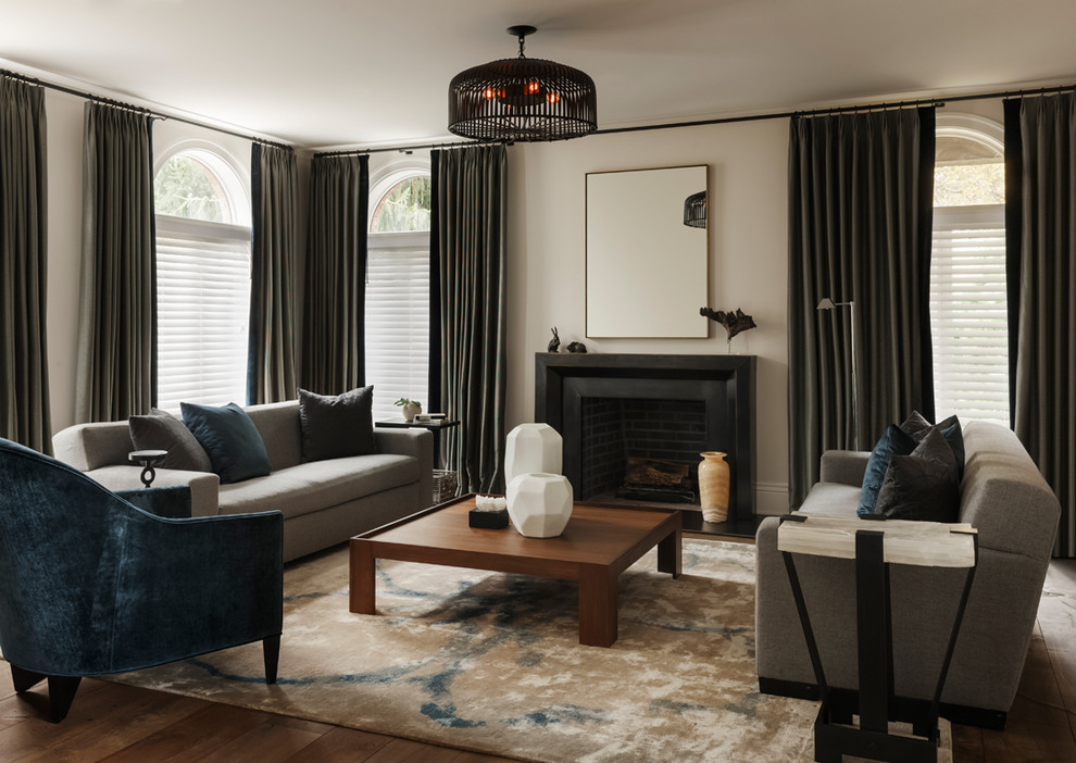 Traditional living room in Philadelphia with black walls, medium hardwood flooring and grey floors.