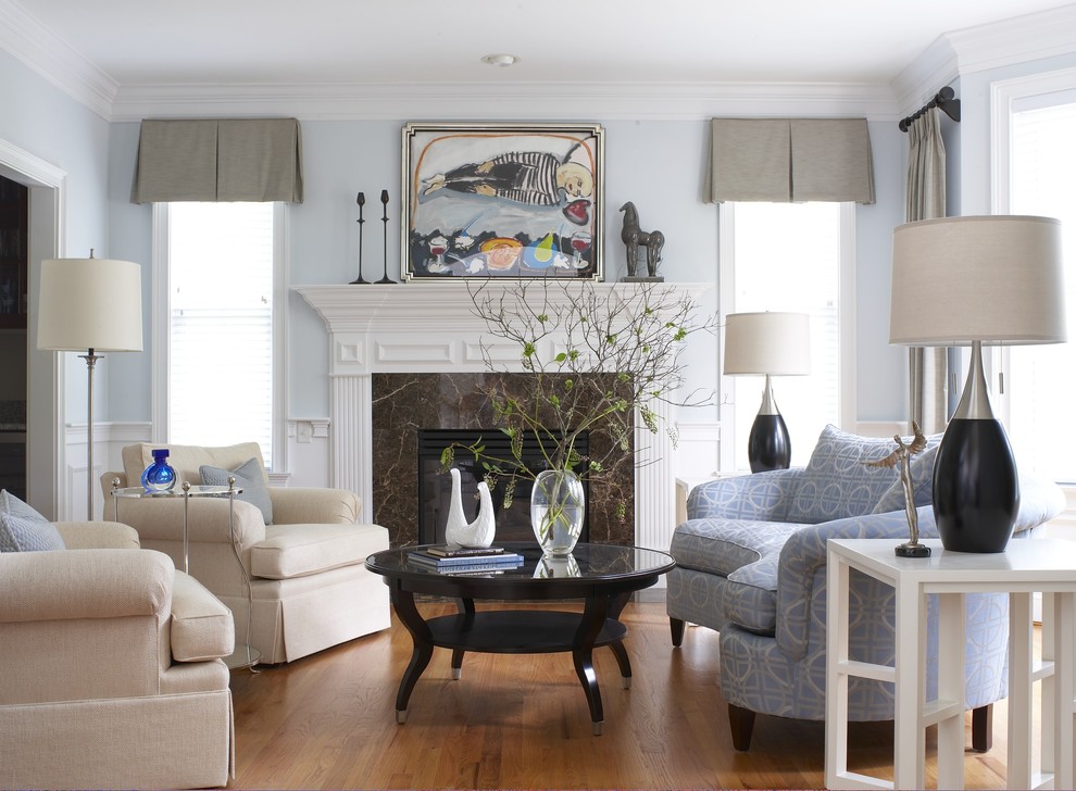 Classic grey and cream living room in Bridgeport with blue walls and a standard fireplace.