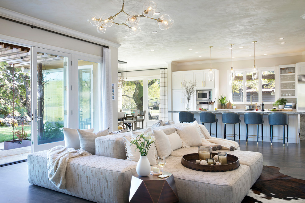 Living room - transitional open concept dark wood floor and gray floor living room idea in Orange County with beige walls