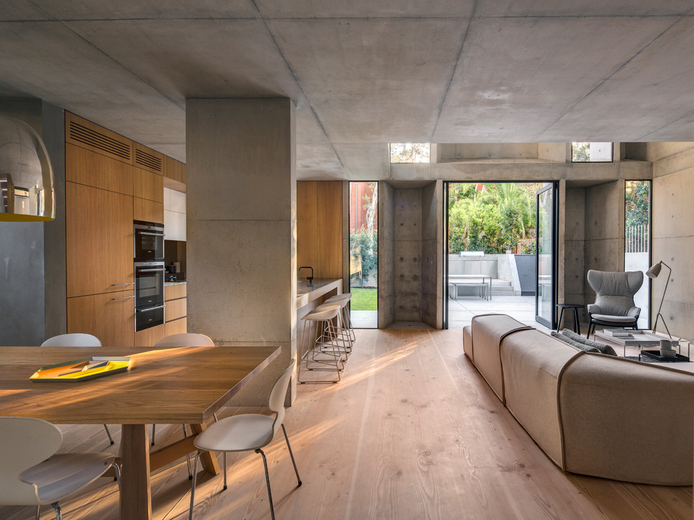 Photo of a medium sized modern open plan living room in Sydney with light hardwood flooring.