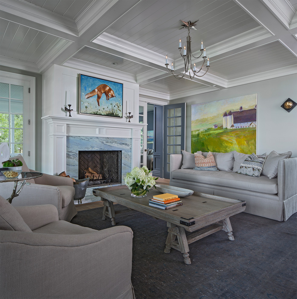 Inspiration for a coastal living room remodel in Detroit with gray walls, a standard fireplace and a stone fireplace