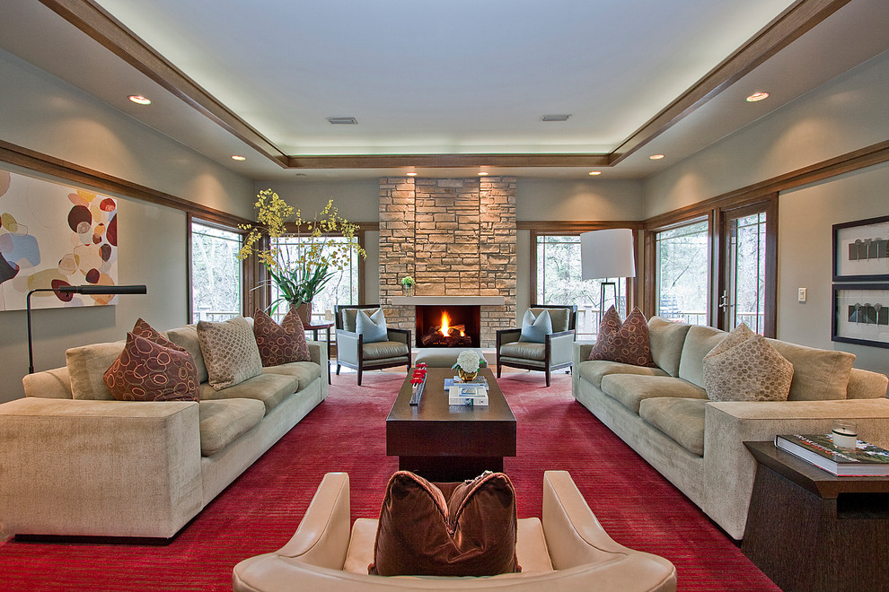 This is an example of a contemporary formal living room in Little Rock with grey walls, a standard fireplace, a stone fireplace surround and no tv.