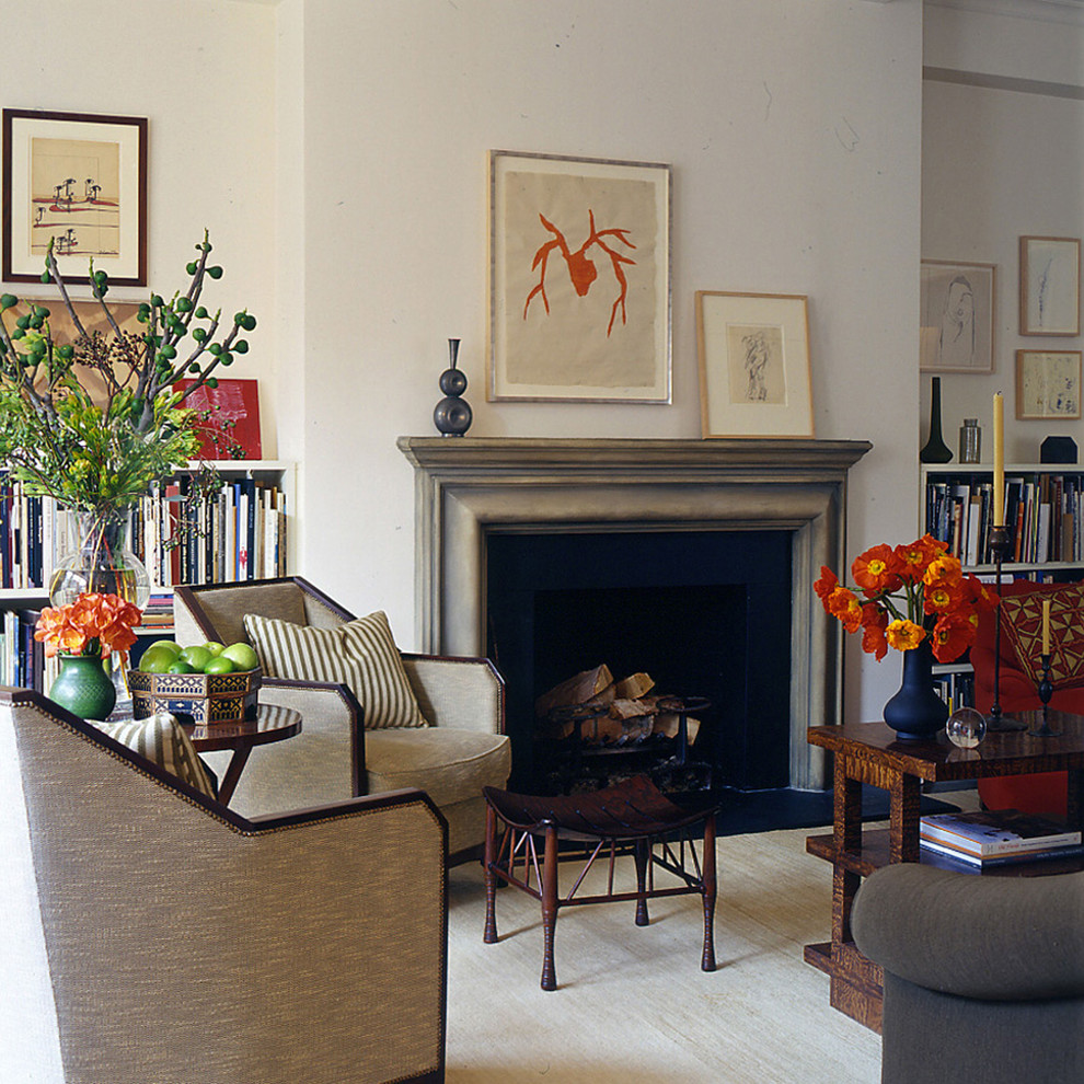 Example of a trendy living room design in New York with white walls and a standard fireplace