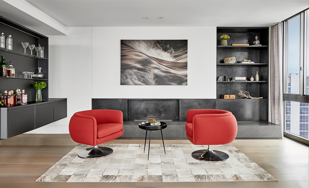 Foto di un soggiorno minimal di medie dimensioni e aperto con pavimento in legno massello medio, pareti bianche e pavimento marrone