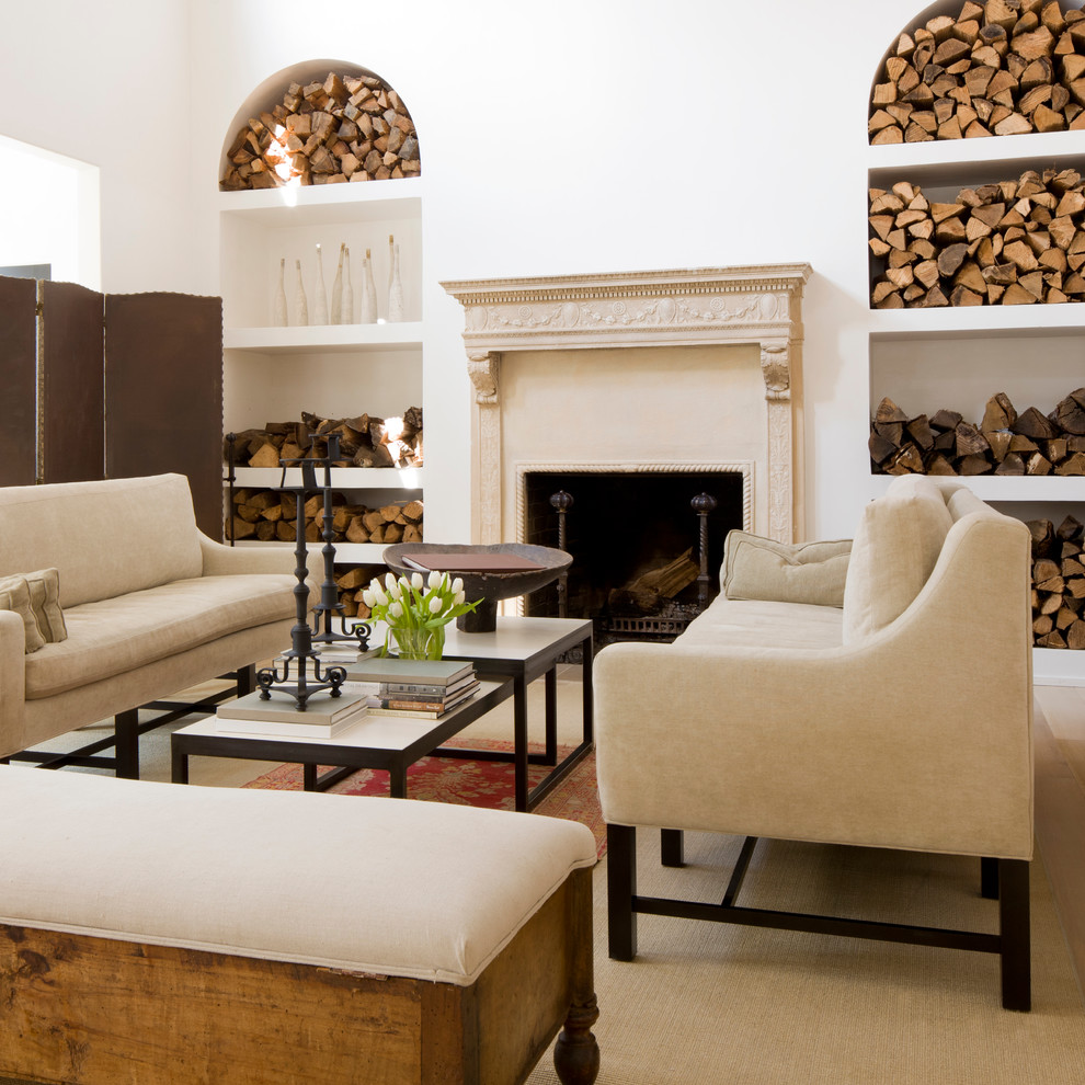 Example of a classic living room design in Other with white walls and a standard fireplace