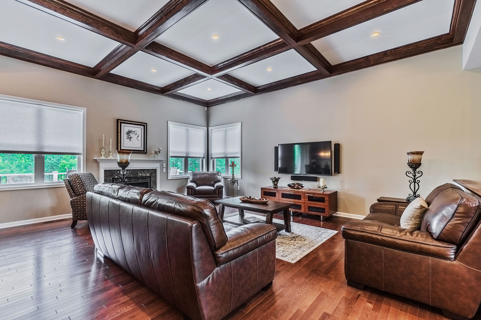 Inspiration for a huge timeless formal and open concept medium tone wood floor and brown floor living room remodel in New York with beige walls, a standard fireplace, a tile fireplace and a wall-mounted tv