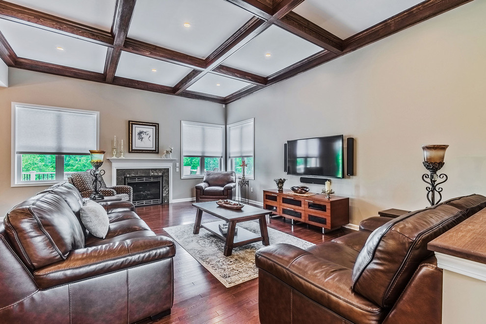 Example of a huge classic formal and open concept medium tone wood floor and brown floor living room design in New York with beige walls, a standard fireplace, a tile fireplace and a wall-mounted tv