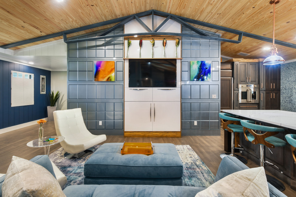 Example of a mid-sized eclectic open concept bamboo floor and brown floor living room design in Miami with a bar, blue walls, no fireplace and a media wall