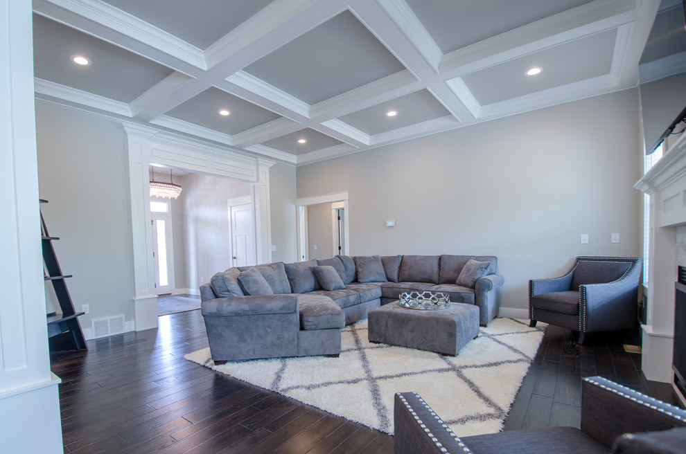 Inspiration for a medium sized traditional formal open plan living room in Other with grey walls, dark hardwood flooring, a standard fireplace and a wall mounted tv.