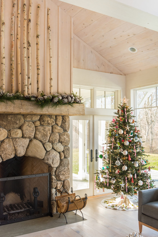Living room - large rustic formal and open concept light wood floor and beige floor living room idea in New York with beige walls, a standard fireplace, a stone fireplace and a concealed tv