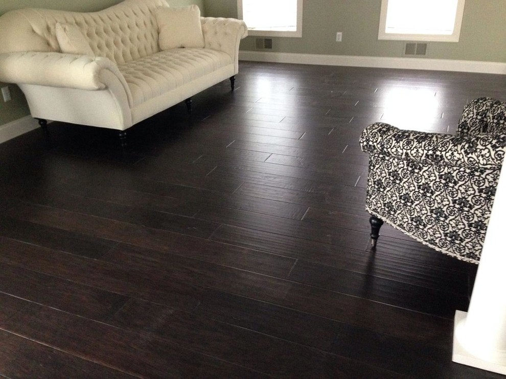 This is an example of a contemporary living room in Los Angeles with dark hardwood flooring.
