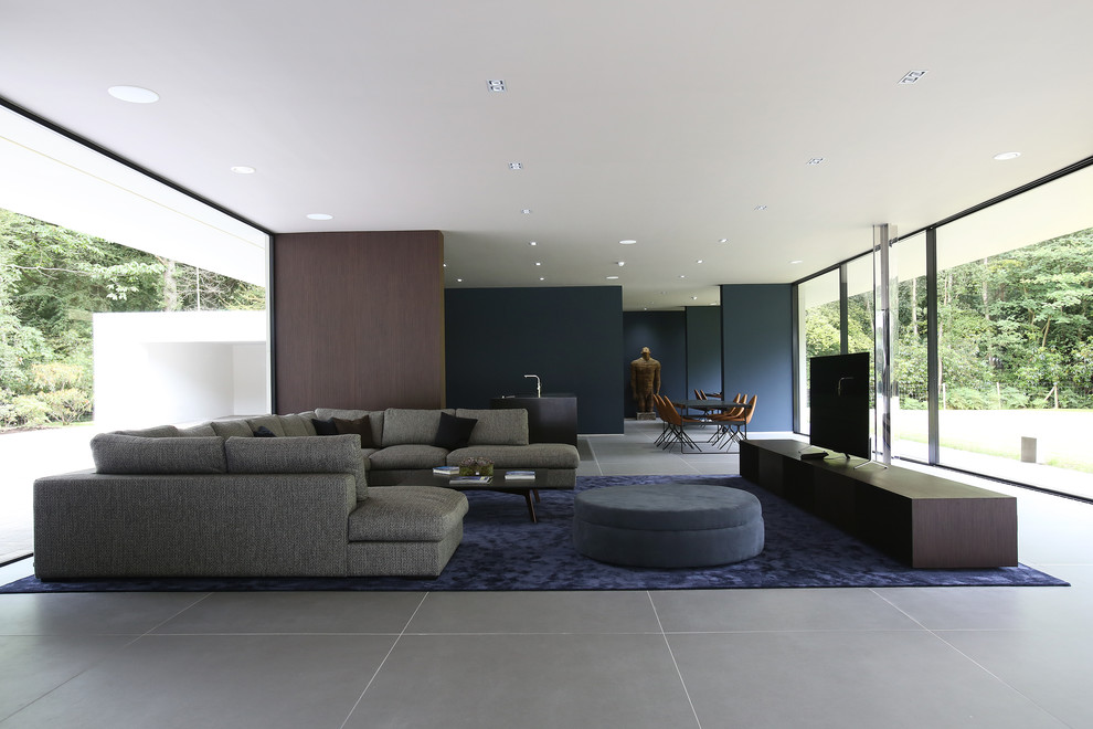 Inspiration for a contemporary open plan living room in London with a freestanding tv.