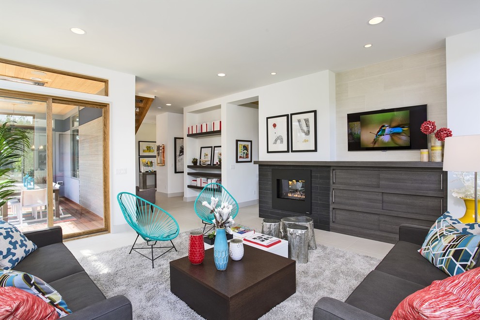 Trendy formal and open concept living room photo in Seattle with white walls, a standard fireplace and a wall-mounted tv