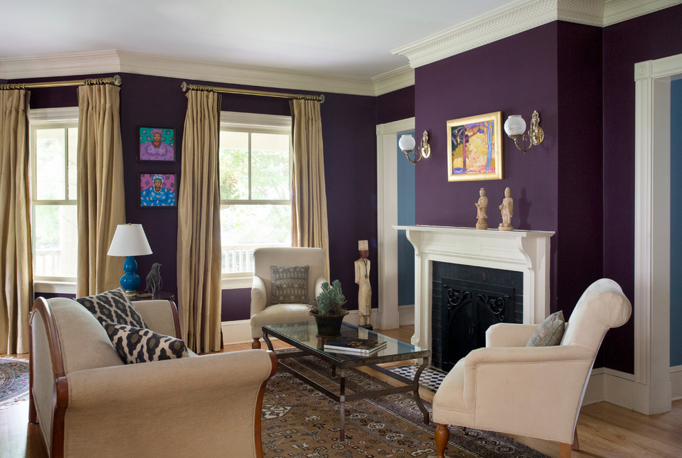Living room - mid-sized traditional formal and open concept medium tone wood floor living room idea in Boston with purple walls, no tv and a standard fireplace