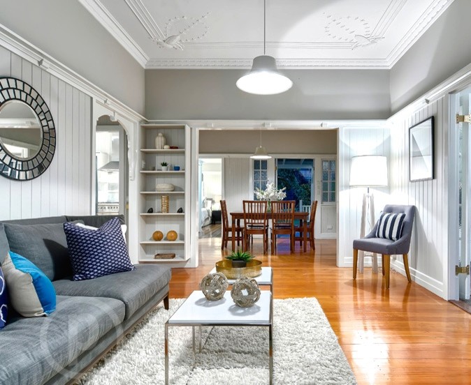 Medium sized classic enclosed living room in Brisbane with grey walls, medium hardwood flooring and a freestanding tv.