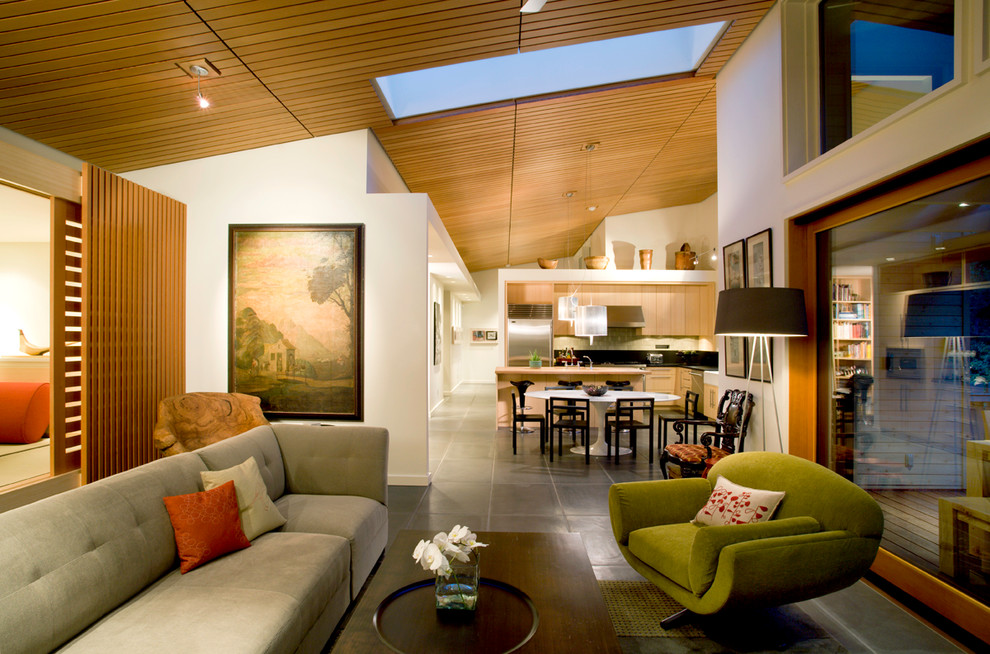 Photo of a contemporary open plan living room in Seattle with white walls and slate flooring.