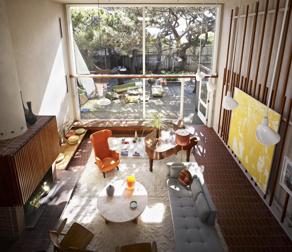 Idee per un soggiorno minimalista con pavimento in mattoni
