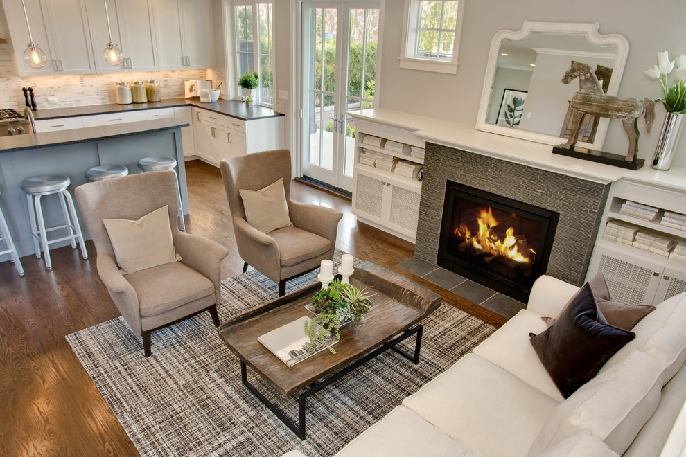 Inspiration for a craftsman open concept medium tone wood floor living room remodel in Seattle with gray walls, a standard fireplace, a tile fireplace and a wall-mounted tv