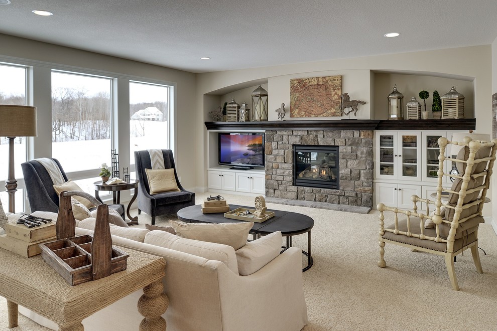 Example of a large classic open concept carpeted living room design in Minneapolis with white walls, a standard fireplace, a stone fireplace and a media wall