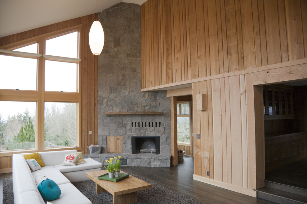 Idee per un grande soggiorno minimalista con camino ad angolo e cornice del camino in pietra