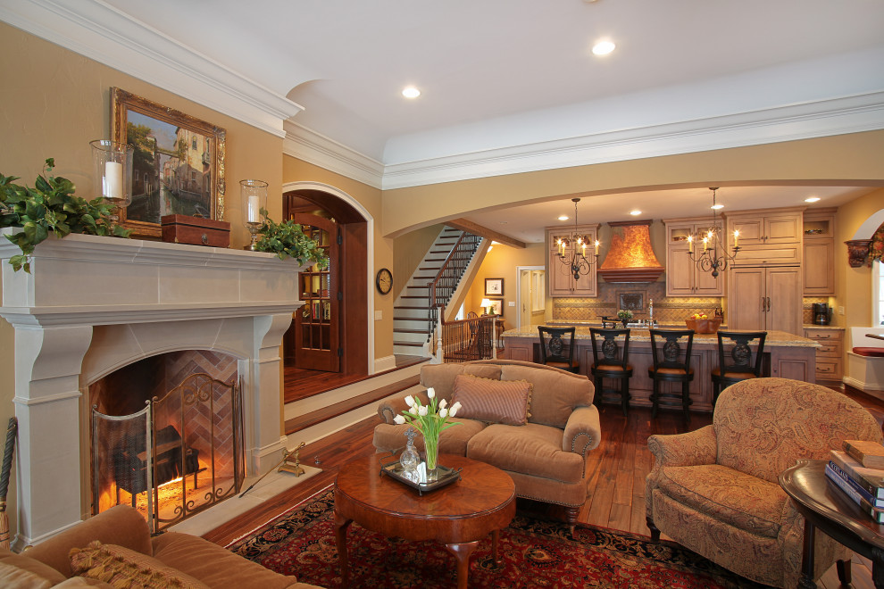 Design ideas for an expansive traditional open plan living room in Other with medium hardwood flooring, a standard fireplace, a stone fireplace surround and a drop ceiling.