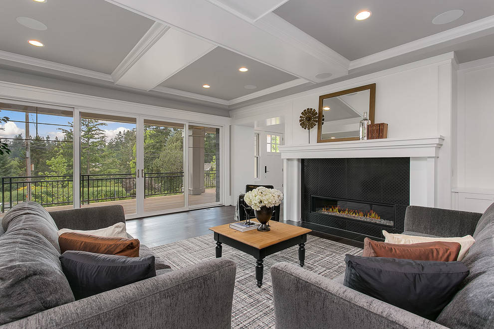 Huge transitional open concept dark wood floor living room photo in Seattle with gray walls, a standard fireplace and a tile fireplace