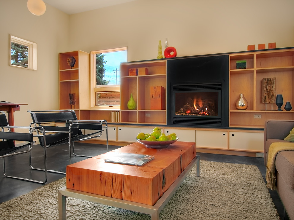 Medium sized modern formal living room in Seattle with a metal fireplace surround, beige walls, concrete flooring, a ribbon fireplace and beige floors.