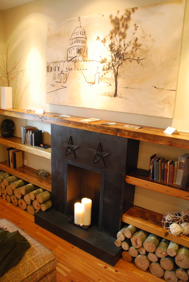 Example of a mountain style living room library design in Richmond with a standard fireplace